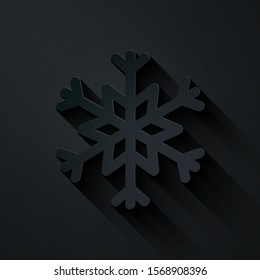 Paper cut Snowflake icon isolated on black background. Paper art style. Vector Illustration
