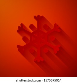 Paper cut Snowflake icon isolated on red background. Paper art style. Vector Illustration