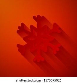 Paper cut Snowflake icon isolated on red background. Paper art style. Vector Illustration