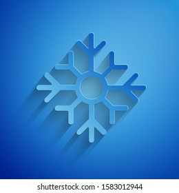 Paper cut Snowflake icon isolated on blue background. Merry Christmas and Happy New Year. Paper art style. Vector Illustration
