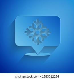 Paper cut Snowflake with speech bubble icon isolated on blue background. Merry Christmas and Happy New Year. Paper art style. Vector Illustration