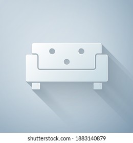 Paper cut Sofa icon isolated on grey background. Paper art style. Vector