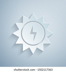 Paper cut Solar energy panel icon isolated on grey background. Sun with lightning symbol. Paper art style. Vector Illustration