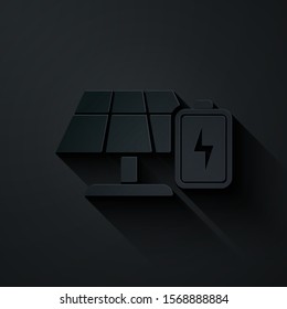 Paper cut Solar energy panel and battery icon isolated on black background. Paper art style. Vector Illustration