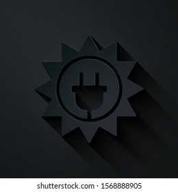 Paper cut Solar energy panel icon isolated on black background. Sun and electric plug. Paper art style. Vector Illustration