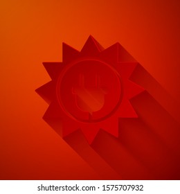Paper cut Solar energy panel icon isolated on red background. Sun and electric plug. Paper art style. Vector Illustration