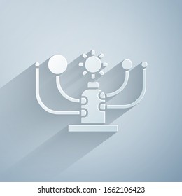 Paper cut Solar system icon isolated on grey background. The planets revolve around the star. Paper art style. Vector Illustration
