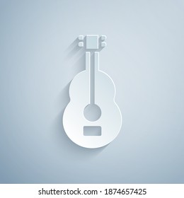 Paper cut Spanish guitar icon isolated on grey background. Acoustic guitar. String musical instrument. Paper art style. Vector.