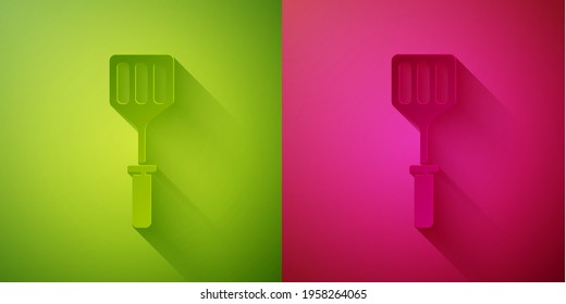 Paper cut Spatula icon isolated on green and pink background. Kitchen spatula icon. BBQ spatula sign. Barbecue and grill tool. Paper art style. Vector Illustration