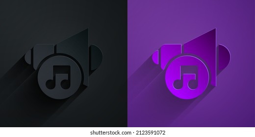 Paper cut Speaker volume, audio voice sound symbol, media music icon isolated on black on purple background. Paper art style. Vector