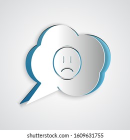 Paper cut Speech bubble with sad smile icon isolated on grey background. Emoticon face. Paper art style. Vector Illustration