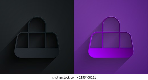 Paper cut Sport bag icon isolated on black on purple background. Paper art style. Vector