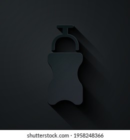 Paper cut Sport bottle with water icon isolated on black background. Paper art style. Vector