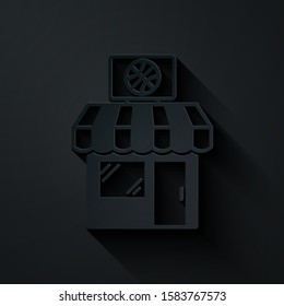 Paper cut Sports shop and basketball ball icon isolated on black background. Sport store. Paper art style. Vector Illustration