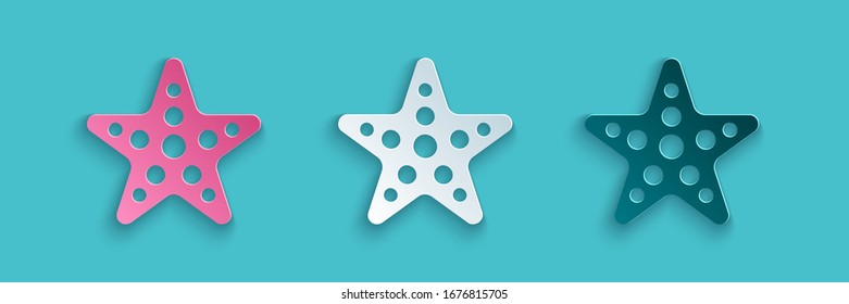 Paper cut Starfish icon isolated on blue background. Paper art style. Vector Illustration