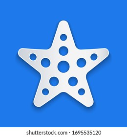 Paper cut Starfish icon isolated on blue background. Paper art style. Vector Illustration