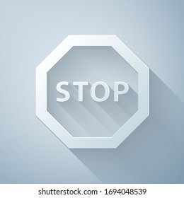 Paper cut Stop sign icon isolated on grey background. Traffic regulatory warning stop symbol. Paper art style. Vector Illustration