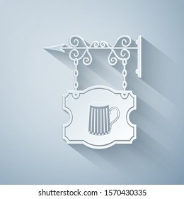 Paper cut Street signboard hanging on forged brackets with wooden mug of beer icon isolated on grey background. Suitable for bar, tavern, cafe, pub, restaurant. Paper art style. Vector Illustration