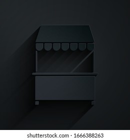 Paper cut Street stall with awning and wooden rack icon isolated on black background. Kiosk with wooden rack. Paper art style. Vector Illustration