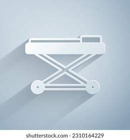 Paper cut Stretcher icon isolated on grey background. Patient hospital medical stretcher. Paper art style. Vector