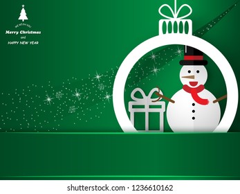 Paper cut style, Merry Christmas and happy new year snowman and gift box symbol in Christmas ball on green background with copy space ,vector illustration eps10.