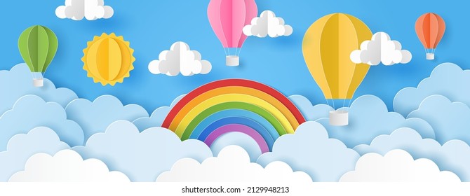 Paper cut style of sun, clouds and hot air balloons with rainbow on blue sky. Summer background.  Vector illustration