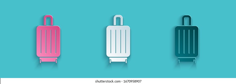 Paper cut Suitcase for travel icon isolated on blue background. Traveling baggage sign. Travel luggage icon. Paper art style. Vector Illustration