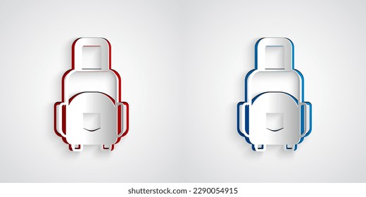 Paper cut Suitcase for travel icon isolated on grey background. Traveling baggage sign. Travel luggage icon. Paper art style. Vector
