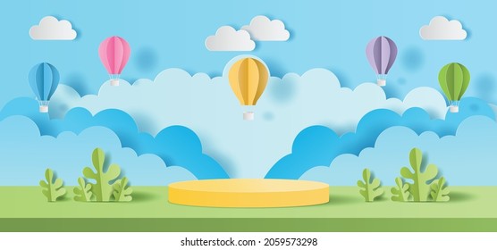 Paper cut of Summer season on green nature landscape, hot air balloons and clouds on blue sky background with yellow color cylinder podium for products display presentation