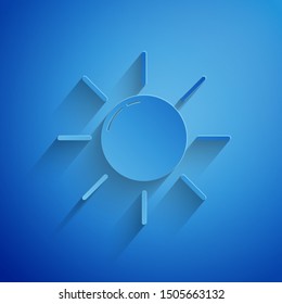 Paper cut Sun icon isolated on blue background. Paper art style. Vector Illustration