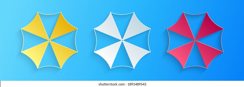 Paper cut Sun protective umbrella fo beach icon isolated on blue background. Large parasol for outdoor space. Summer vacation or picnic accessory. Paper art style. Vector.