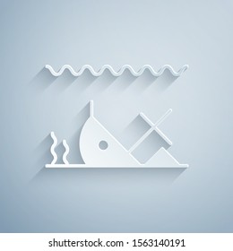 Paper cut Sunken ship at the bottom of the sea icon isolated on grey background. Paper art style. Vector Illustration