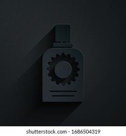 Paper cut Sunscreen spray bottle icon isolated on black background. Protection for the skin from solar ultraviolet light. Paper art style. Vector Illustration