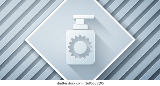 Paper cut Sunscreen spray bottle icon isolated on grey background. Protection for the skin from solar ultraviolet light. Paper art style. Vector Illustration