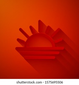 Paper cut Sunset icon isolated on red background. Paper art style. Vector Illustration