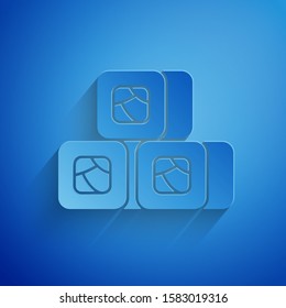 Paper cut Sushi icon isolated on blue background. Traditional Japanese food. Paper art style. Vector Illustration