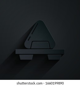 Paper cut Sushi on cutting board icon isolated on black background. Asian food sushi on wooden board. Paper art style. Vector Illustration