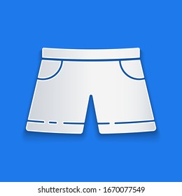 Paper cut Swimming trunks icon isolated on blue background. Paper art style. Vector Illustration
