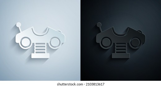 Paper cut Swing car on the playground icon isolated on grey and black background. Childrens carousel with car. Amusement icon. Paper art style. Vector