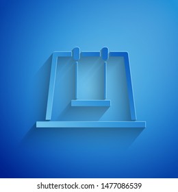 Paper cut Swing icon isolated on blue background. Playground symbol. Paper art style. Vector Illustration