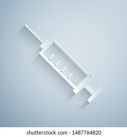 Paper cut Syringe icon isolated on grey background. Syringe for vaccine, vaccination, injection, flu shot. Medical equipment. Paper art style. Vector Illustration