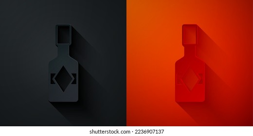 Paper cut Tabasco sauce icon isolated on black and red background. Chili cayenne spicy pepper sauce. Paper art style. Vector