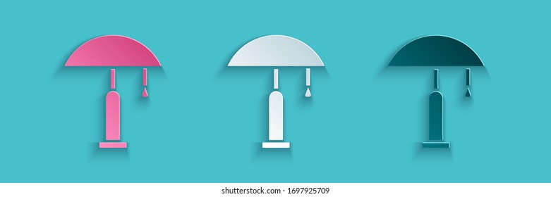 Paper cut Table lamp icon isolated on blue background. Paper art style. Vector Illustration