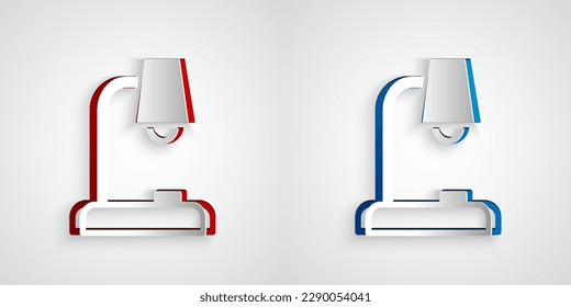 Icono de la lámpara de la mesa de corte de papel aislado en fondo gris. Estilo de arte de papel. Vector