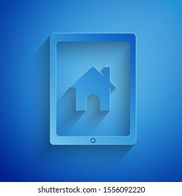 Paper cut Tablet and smart home icon isolated on blue background. Remote control. Paper art style. Vector Illustration
