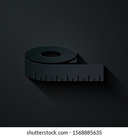 Paper cut Tape measure icon isolated on black background. Measuring tape. Paper art style. Vector Illustration