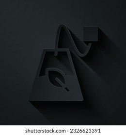 Paper cut Tea bag icon isolated on black background. Paper art style. Vector