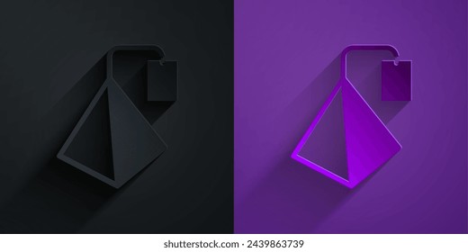 Paper cut Tea bag icon isolated on black on purple background. Paper art style. Vector