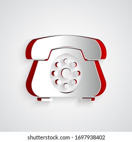 Paper cut Telephone icon isolated on grey background. Landline phone. Paper art style. Vector Illustration