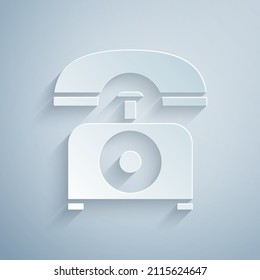 Paper cut Telephone icon isolated on grey background. Landline phone. Paper art style. Vector Illustration